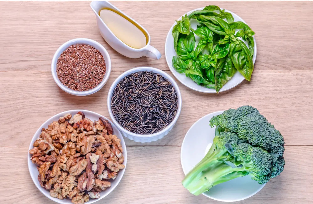 A colorful plate featuring salmon, walnuts, and chia seeds, showcasing a daily Omega 3 meal plan.