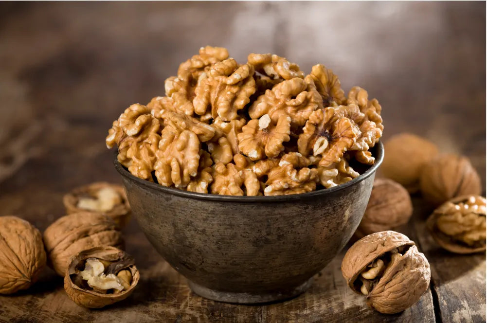 A bowl of walnuts highlighting their benefits for brain health and memory enhancement.